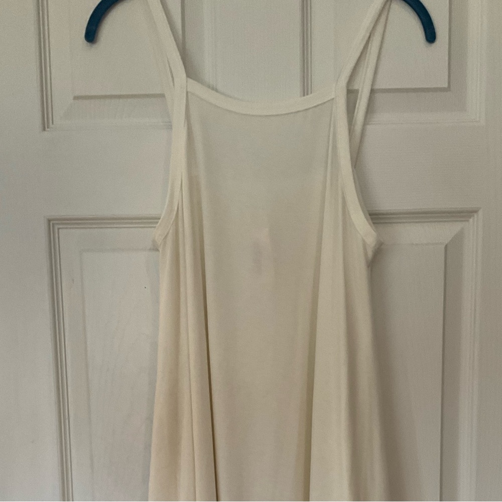 Cream colored sleeveless dress with a flowered kimono.